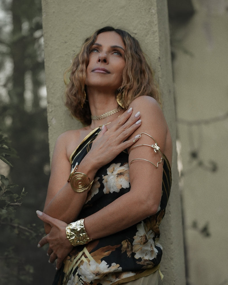 Kiki, founder and creative director of Mazonkiki, wearing her own silk scarf design as a top with handcrafted gold jewellery