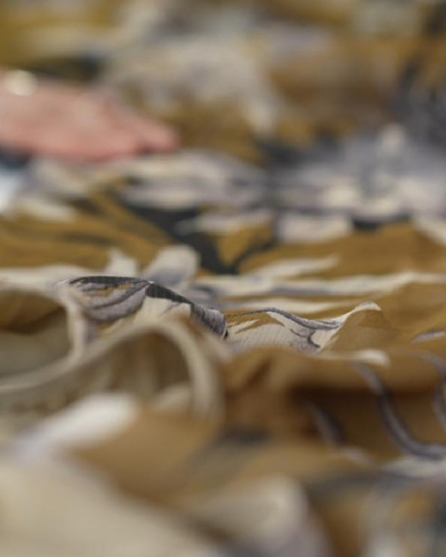 Artisan hands crafting Mazonkiki clothing in Ankara Turkey and leather bags in Hoi An Vietnam