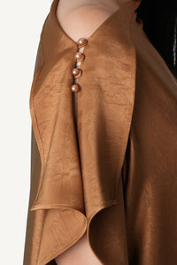 Mazonkiki Caramel Fold lounge dress — effortless asymmetric drape in light-catching tobacco satin