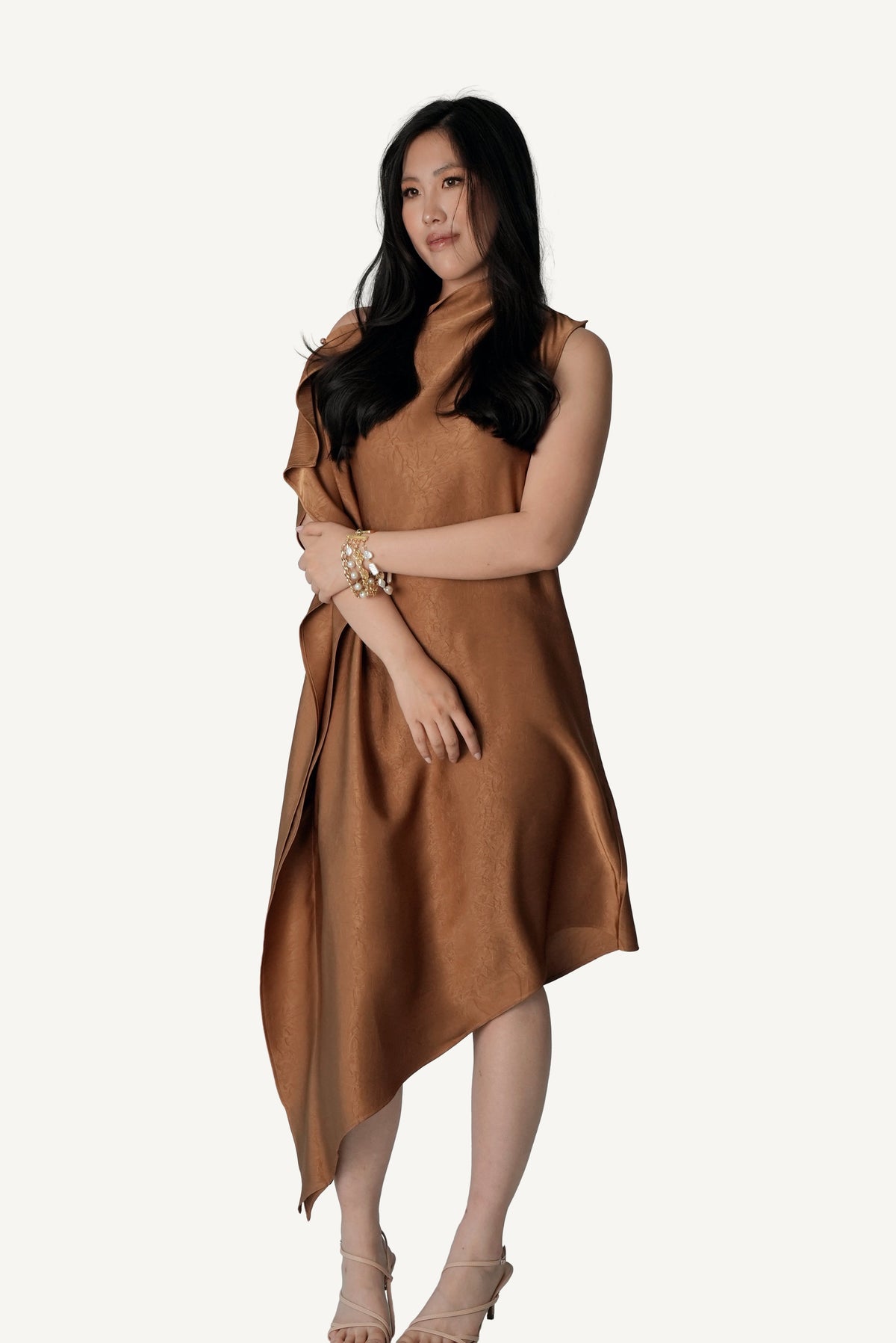 Side profile of Mazonkiki Caramel Fold dress — draped satin panel in effortless fluid movement
