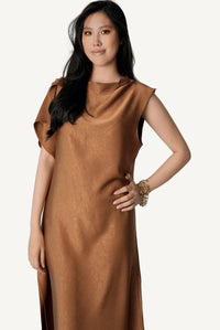 Mazonkiki Caramel Fold — flowing asymmetric elegance in warm caramel satin, unhurried silhouette