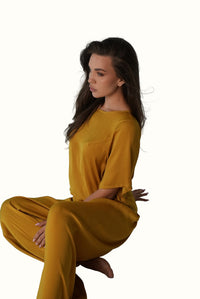 Mazonkiki boxy cropped tee in saturated mustard, paired with wide-leg pants — refined loungewear set