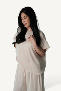Mazonkiki Pale Repose lounge set — ivory wide-leg trouser pooling at floor beside relaxed cropped tee