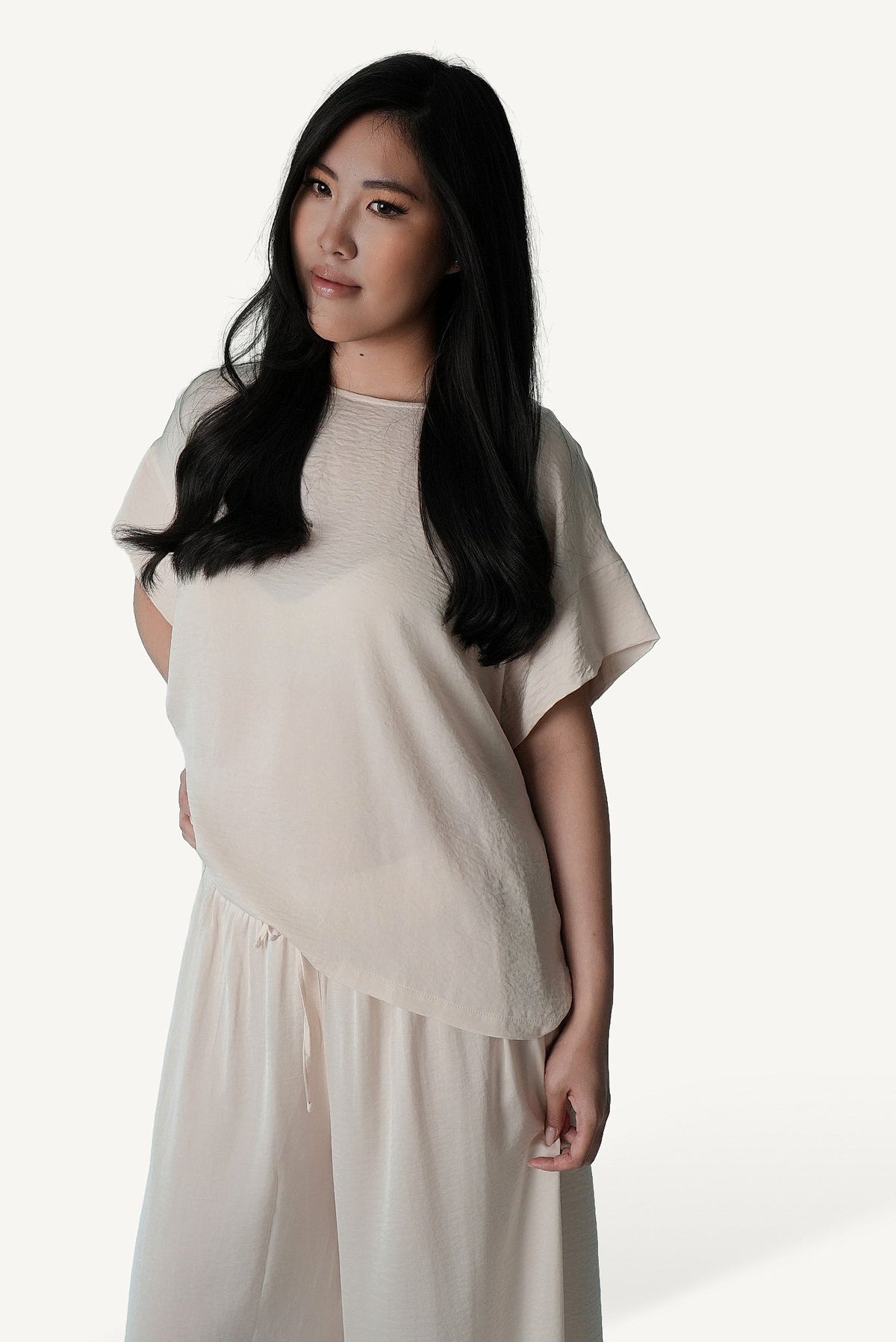 Mazonkiki Pale Repose ivory cropped tee with relaxed hip drape, styled with wide-leg lounge trouser