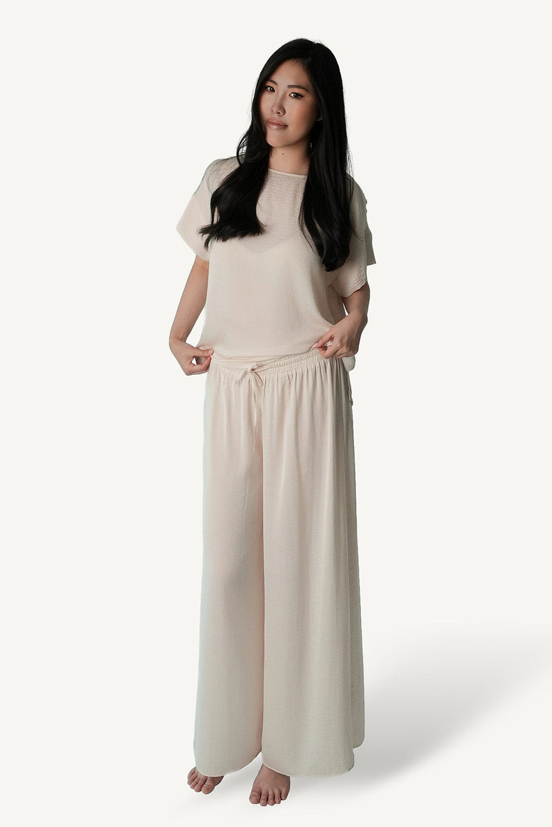 Mazonkiki Pale Repose ivory wide-leg lounge set — relaxed cropped tee and floor-pooling trouser