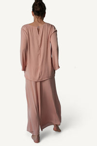 Mazonkiki Rose Dusk wide-leg pants close-up — fluid dusty rose fabric with effortless drape and movement