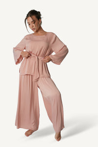 Mazonkiki Rose Dusk lounge set styled — bateau-neck top paired with flowing wide-leg trousers in blush rose