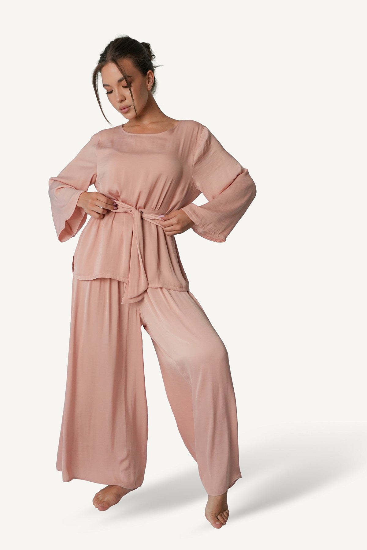 Mazonkiki Rose Dusk lounge set styled — bateau-neck top paired with flowing wide-leg trousers in blush rose